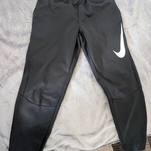 Nike Kids Black Joggers with White Swoosh